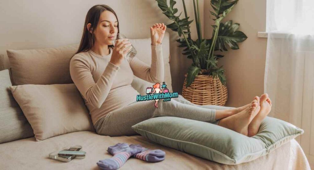 Postpartum mother resting with legs elevated, drinking water and using compression socks at home