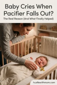 Baby crying after the pacifier falls out while a tired mother reaches to comfort the baby during bedtime.